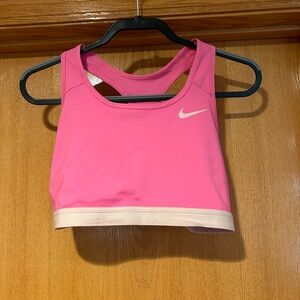 Nike women’s Dri-Fit sports bra pink with white band. Gently used like new.
